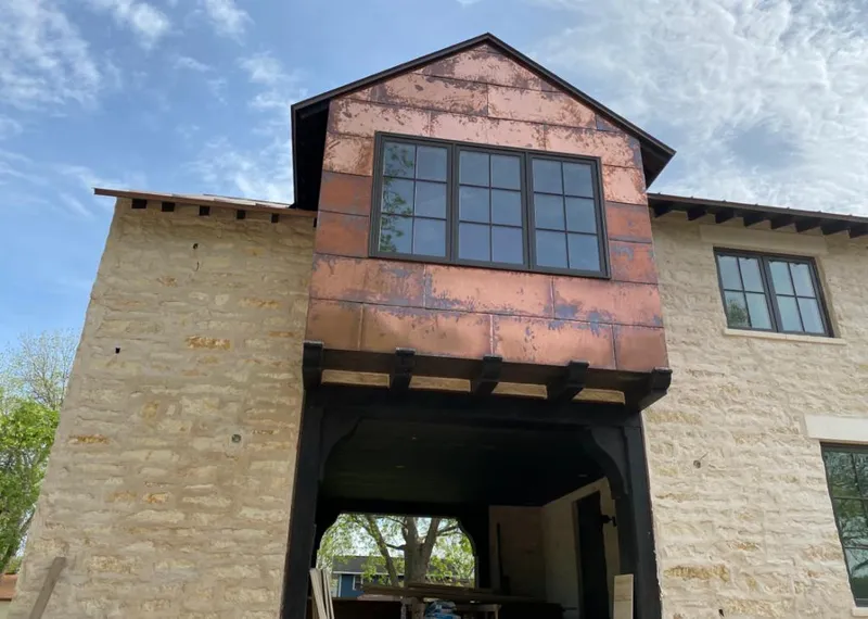 Copper metal panel facade on a stone building for Roof Repair in Sahuarita